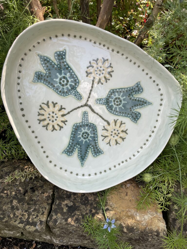 Tulip Ware dish in blues and teals